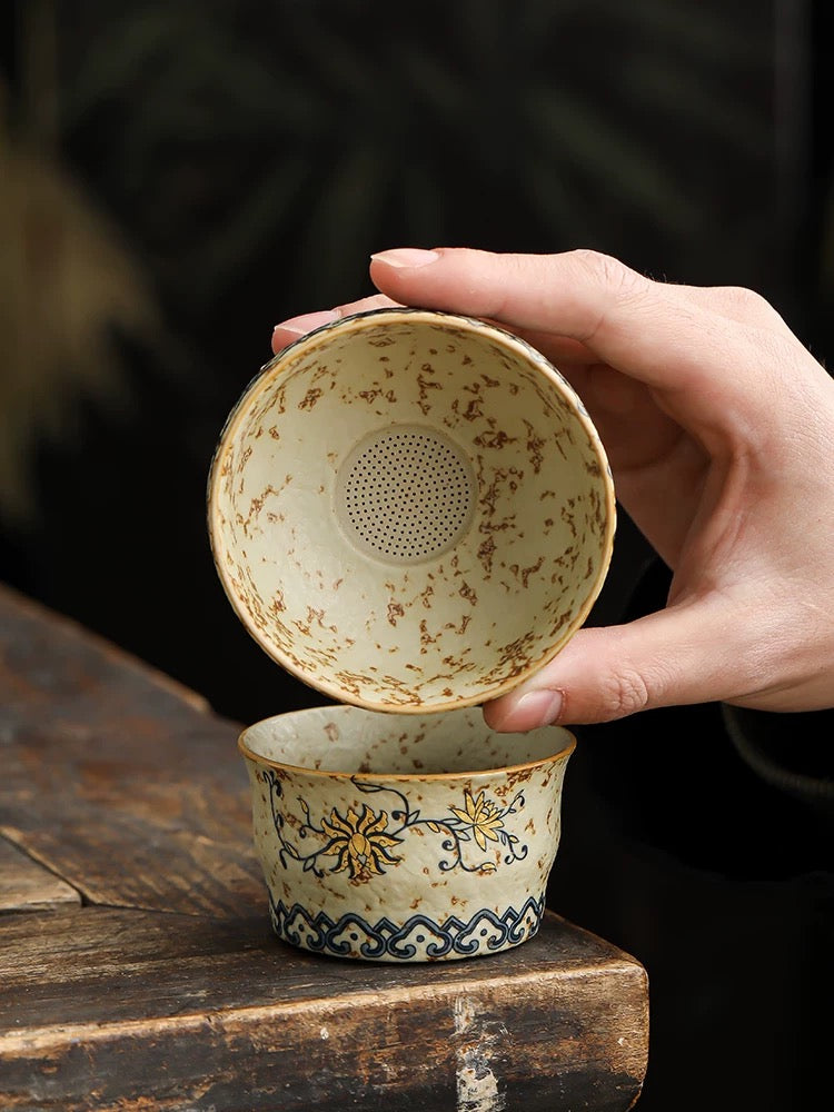 Teacup and tea strainer set