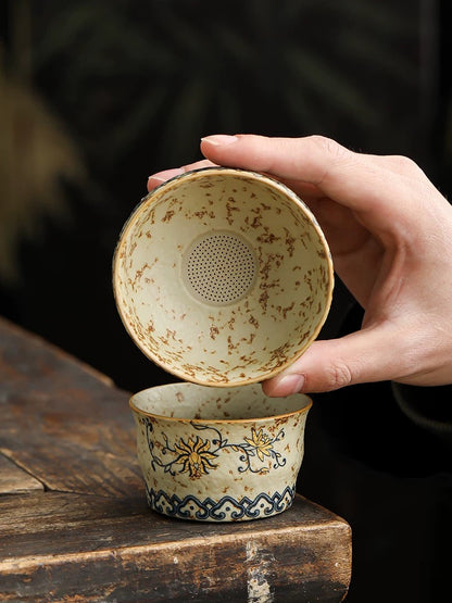 Teacup and tea strainer set