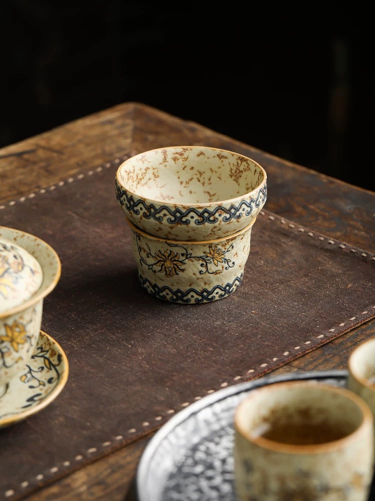 Teacup and tea strainer set