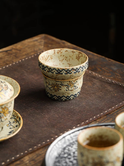 Teacup and tea strainer set