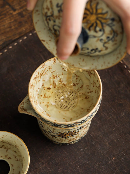 Teacup and tea strainer set