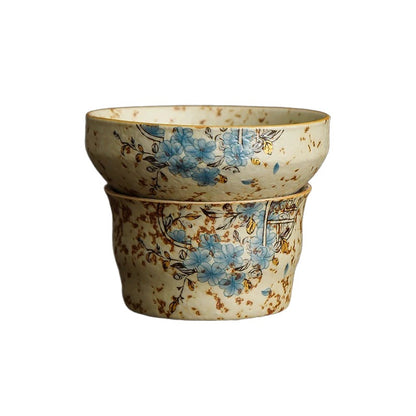 Teacup and tea strainer set